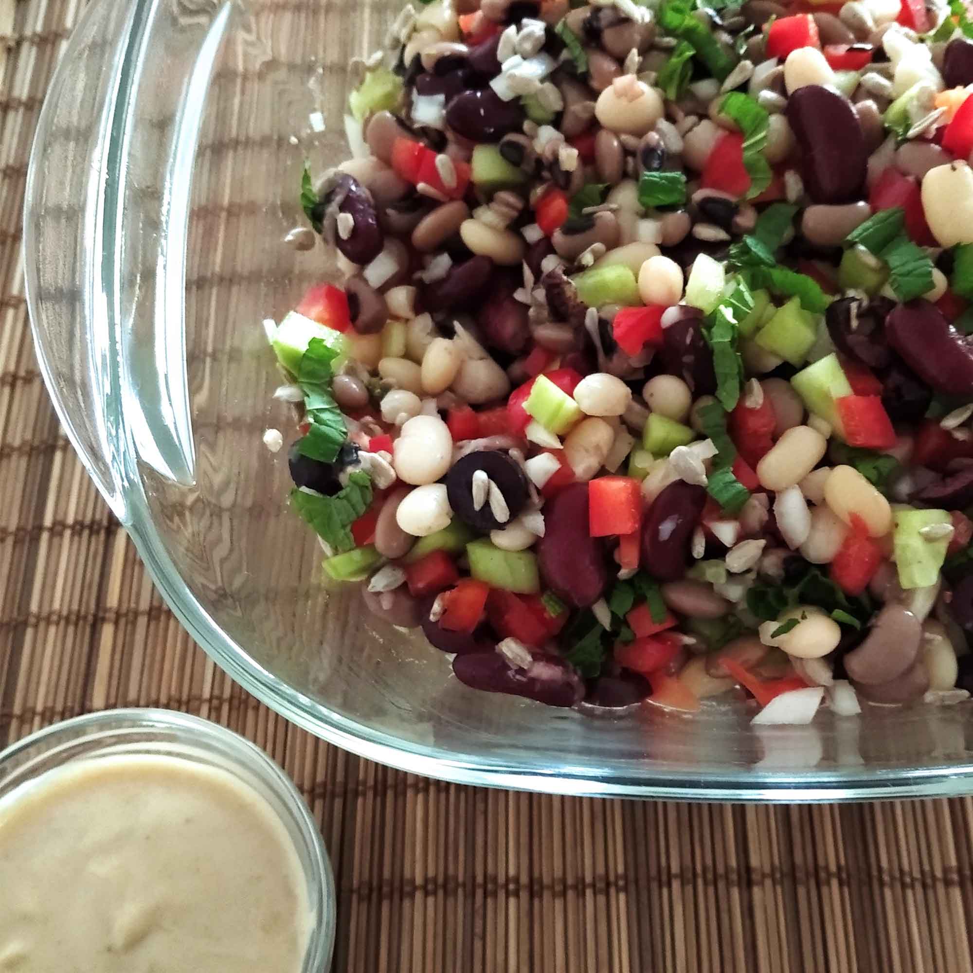 summer salad with mix legumes tahini dressing